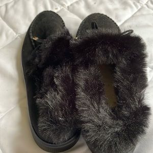 Made in China. Black pair of new moccasins